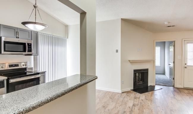 a kitchen with a marble counter top