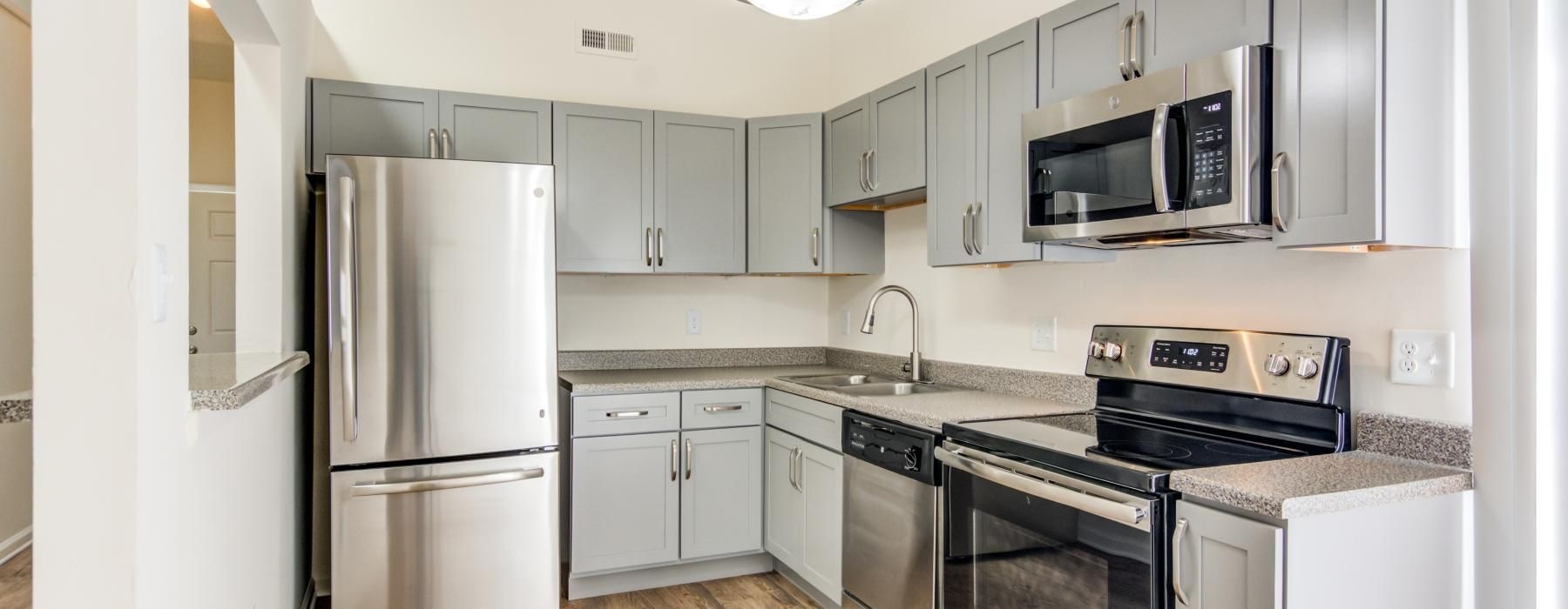 a kitchen with white cabinets