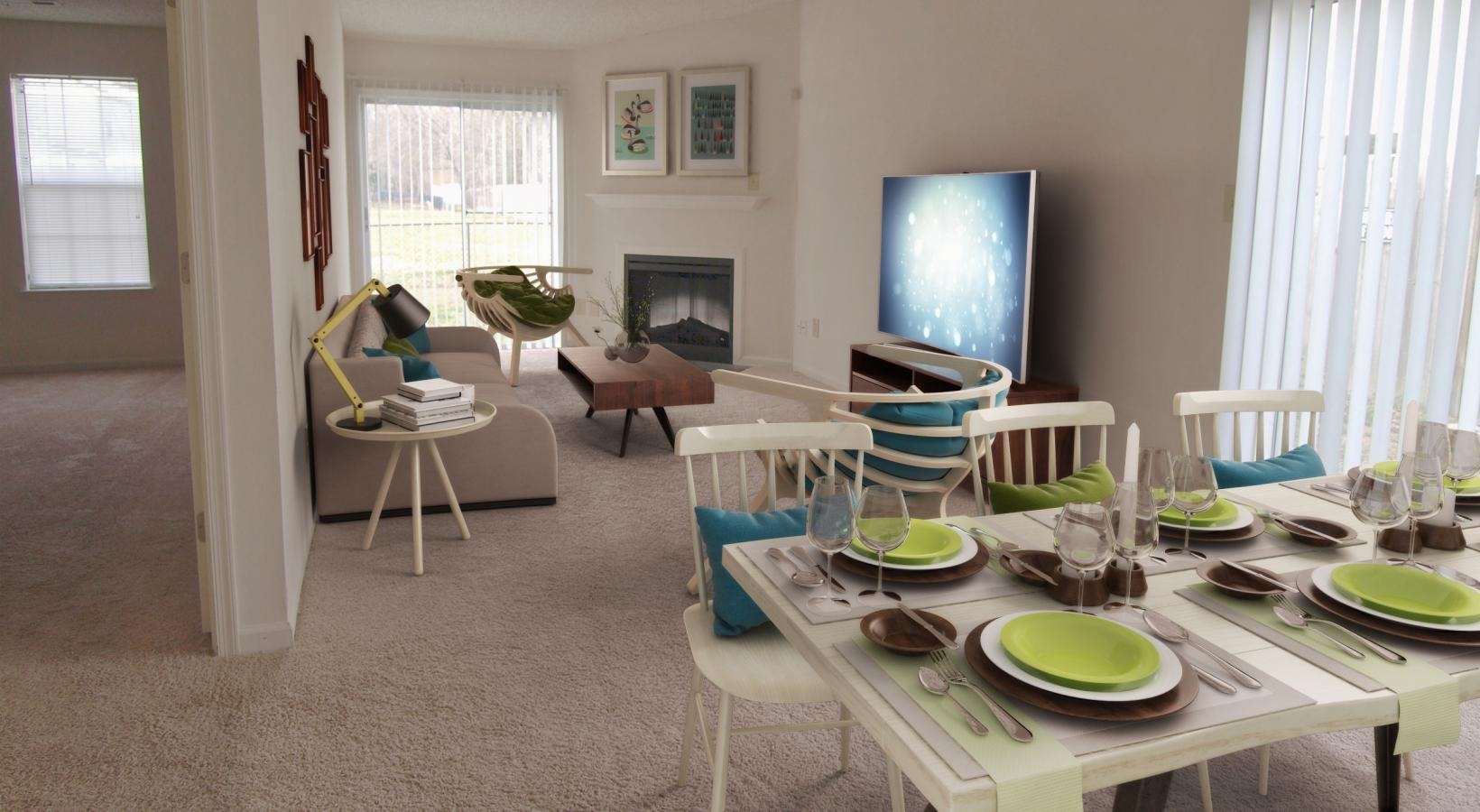 a living room with a table and chairs